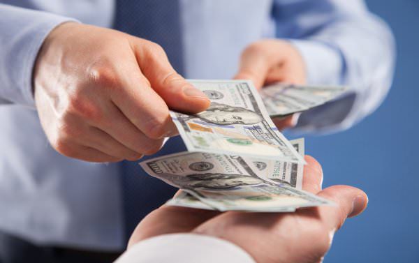 Man paying money to cashier