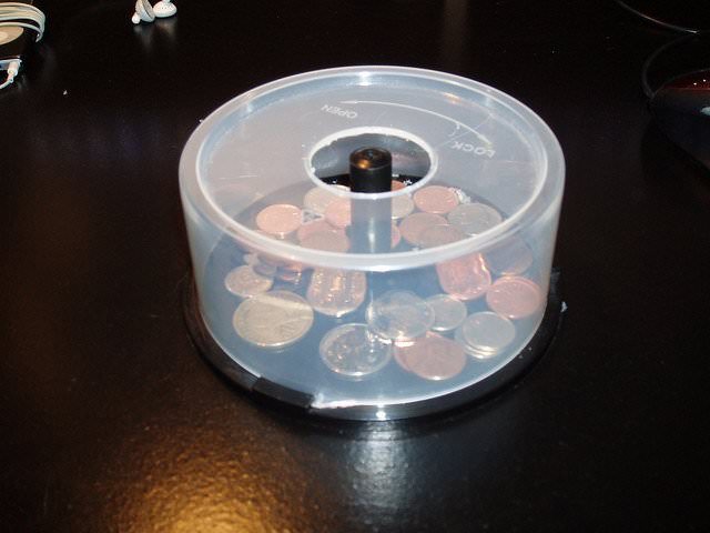 CD spindle as a coin bank